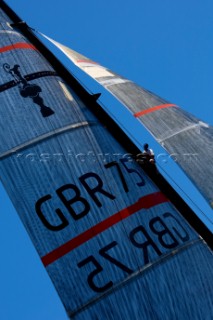 Team Origins GBR-75 makes its maiden voyage from Port Americas Cup in Valencia in company with the yacht America.