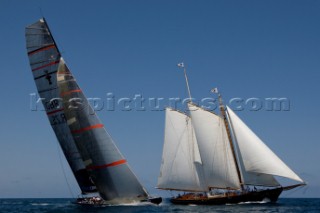 Team Origins GBR-75 makes its maiden voyage from Port Americas Cup in Valencia in company with the yacht America.