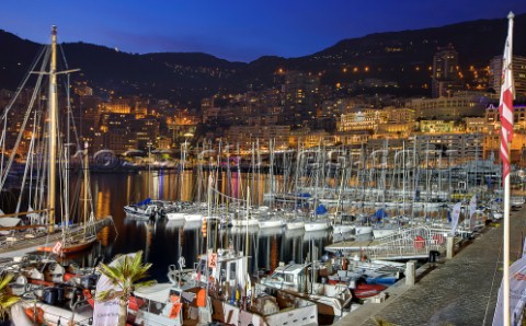 Superyachts moored in Monaco harbour port with yachts sailing