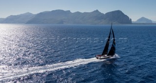 SFS II, Sail n: FRA 1953, Boat Type: VOR 70, Skipper: Lionel Pean, Country: France passing  San Vito lo Capo