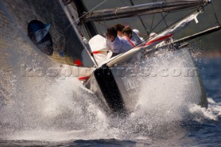 All4One (GER) follows Artemis (SWE) around the first mark in their round robin match. Louis Vuitton Trophy, La Maddalena, Sardinia, Italy. 3/6/2010