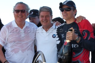 Emirates Team New Zealand helmsman Dean Barker celebrates with Bruno Trouble and Yves carcel of Loiuis Vuitton after the teams 3 - 2 win over Synergy (RUS) in the finals. Louis Vuitton Trophy. La Maddalena, Sardinia, Italy. 6/6/2010
