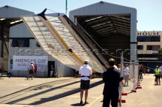 Oracle Racing rig and float the first AC45 in Auckland. 16/1/2011. The wing sail mast is stepped with a crance.