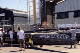 Oracle Racing rig and float the first AC45 in Auckland. 16/1/2011. The wing sail mast is stepped with a crance.