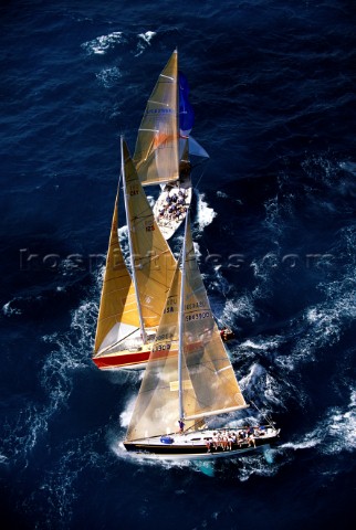 Yachts heading upwind to the windward mark