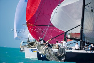 KEY WEST, FLORIDA - January 16th 2007: The bowman onboard the Farr 40 Kokomo from Australia struggles to retrieve the jib from the water as her sistership from America, Flash Gordon, slips into the lead during racing on Day 2 of Key West Race Week 2007 on January 16th 2007. Key West Race Week is the premier racing event in the winter season. (Photo by Sharon Green/Kos Picture Source via Getty Images)