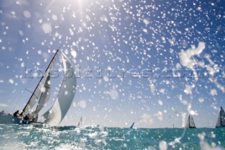 KEY WEST, FLORIDA - January 16th 2007: Melges 32 under spinnkaer surfs through the rough water and spray during racing on Day 2 of Key West Race Week 2007 on January 16th 2007. Key West Race Week is the premier racing event in the winter season. (Photo by Sharon Green/Kos Picture Source via Getty Images)