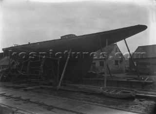 Yacht Britannia on stocks on the hard at Marvins Yard on the south coast, UK, in 1930 prior to being converted to a J-Class