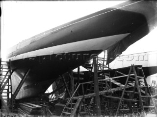 The J-Class Shamrock V owned by Sir Thomas Lipton alongside another J-Class on the hard at Gosport in 1930s