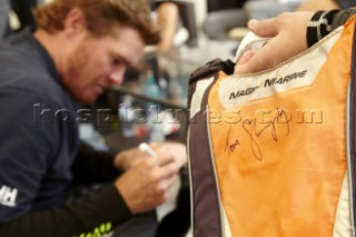 GC32 Austria Cup 2014, Gmunden, Lake Traunsee on May 28 â€“ June 1, 2014. Tom Slingsby (AUS) signs a fans bag.