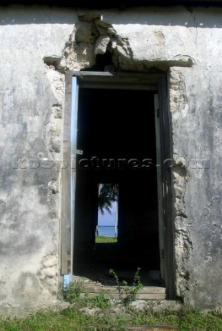 Broken down houses on Aitutaki Island Cook Islands South Pacific