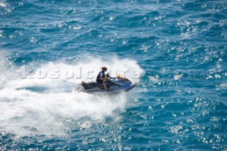 Man jet skiing in the mediterranean sea.