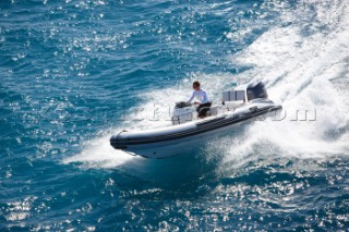 Man using a tender to the superyacht White Cloud