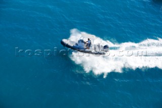 Man using a tender to the superyacht White Cloud