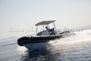 Man using a tender to the superyacht White Cloud