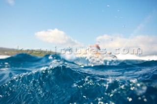 Man jet skiing in the mediterranean sea.