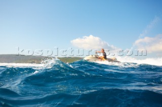 Man jet skiing in the mediterranean sea.