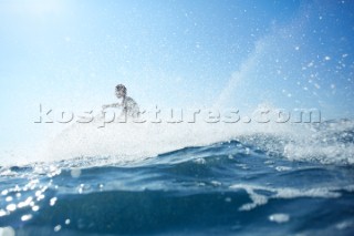 Man jet skiing in the mediterranean sea.