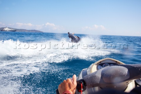 Two men jet skiing in the mediterranean sea