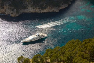 Aerial view of a superyacht and tenders and toys in the mediterranean sea