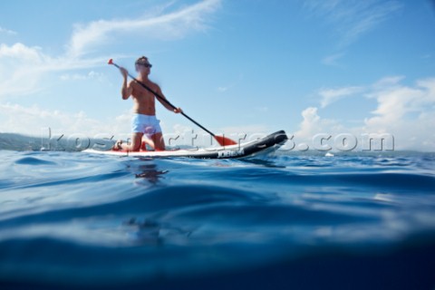 Man riding a paddleboard