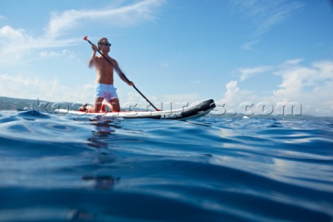 Man riding a paddleboard