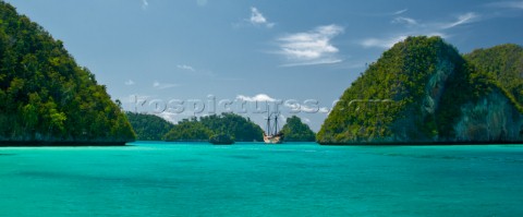 Cruising in Indonesia traditional Phinisi at anchor in Wayag