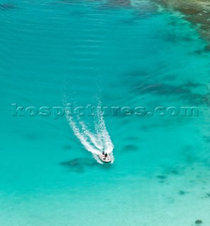 Cruising in Indonesia, elevated view of a speedboat in Wayag, Raja Ampat Islands