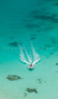 Cruising in Indonesia, elevated view of a speedboat in Wayag, Raja Ampat Islands