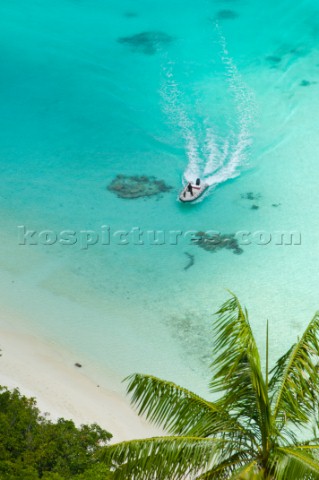 Cruising in Indonesia elevated view of a speedboat in Wayag Raja Ampat Islands