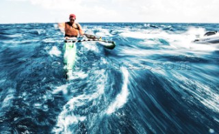 Man on an outrigger canoe