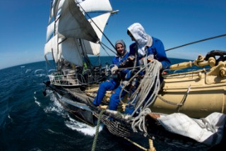 Crew sitting on the bowsprit of Kruzenshtern