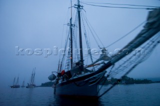 Passengers vacationing on the historic, Camden Maine based schooner Lewis French sailing off the coast of Maine during the annual Schooner Days Festival. July 2004. Festivities include a lobster bake and a schooner race.