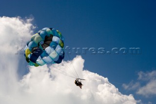 Tourists enjoy a parasail ride above the ocean, Turks and Caicos.