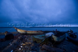 Fishermen prepare their boats in the isolated fishing pueblo of Limones in the province of Esmeraldas, on August 17, 2008.  Many of the pueblos in the province of Esmeraldas, Ecuador, have become more dangerous in recent years because of the drug trade and its proximity to the Colombian jungle.  Fishing is the only job in some villages.  A lack of opportunities has left many people frustrated, especially when there are less fish.  Although many of these communities are living in extreme poverty, a strong sense of identity and family holds the people together and creates a positive and upbeat attitude.