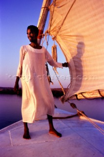 NILE RIVER, EGYPT: Captain Kangaroo at sunset on his faluca taking tourist down the Nile from  Aswan to Luxor. ( Photo by: Christopher Herwig / Aurora)