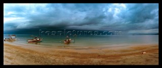 Fishing boats sitting idle on the island of Negros, Philippines.