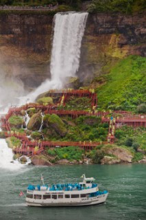 The Maid of the Mist passes by Bridal Veil Falls en route towards the base of Niagara Falls.