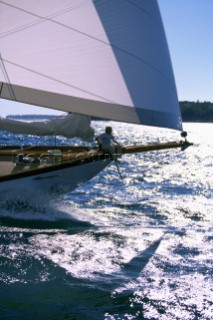 Mac Sprague enjoys the ride on the bow while sailing on the John Alden schooner, Lions Whelp, during the Shipyard Cup Regatta, in  Casco Bay, Maine.