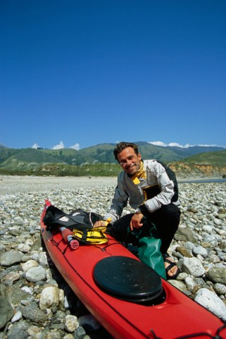 Sea kayak guide Josh Mendenhall poses for a portrait at the Big Sur Rivermouth while on a sea kayak 