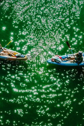 Looking down on the tips of two kayaks on the Russian River in Monte Rio California