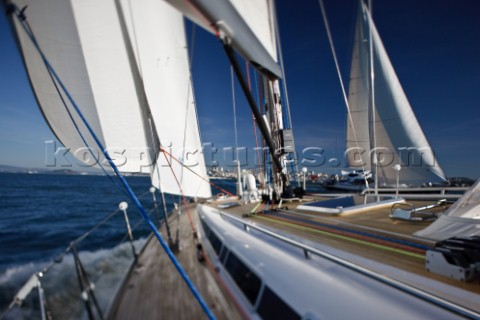 The Swan 48 sloop COLIBRI sails the waters of San Francisco Bay near the city of San Francisco while