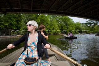 Eva Karlstroem and Frida Mark (l-r) from Stockholm, Sweden stop to take a photograph while boating on The Lake in Central Park.   New York City, NY, May 13, 2008