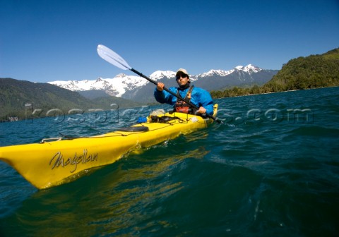 Jonathan Eisenberg paddles a sea kayak during a wilderness adventure in Lago Yelcho Chile