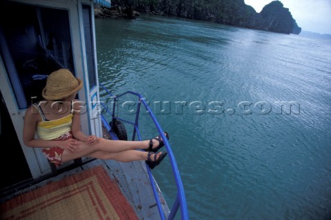 Hanh Quach hanging out on a boat in Halong Bay Vientam