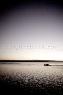 Fishing boat on the Pacific ocean near Washington at sunset.