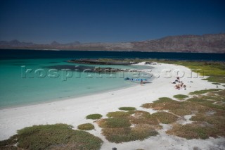 A group of tourists from Loreto bask in the sun and have lunch on nearby  Isla Cornado, Sea of Cortez, Baja California, Mexico.