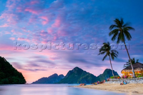 Las Cabanas Beach Resort on Marimegmeg Beach at sunset El Nido Palawan Philippines