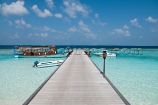 An empty wooden jetty and moored boats, Six Senses Soneva Fushi Resort, Kunfunadhoo Island, Baa (South Maalhousmadulu) Atoll, Maldives, on January 26th, 2010. Thomas Pickard/Aurora Photos/Kos Pictures