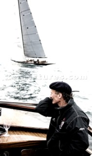 Gentleman spectating the J Class racing from a Venecian Water Taxi motor boat